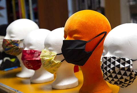 Face masks modelled on styrofoam heads in a tailor shop 'Die Tapfere Schneiderei' (The brave tailoring) in Germany, Friday, March 20, 2020. (Photo | AP)