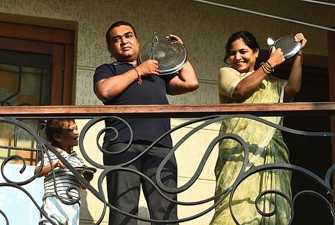 A Family clap their hands at Chennai's Veppery on the Janata Curfew day at Egmore. (Photo | Ashwin Prasath/EPS)