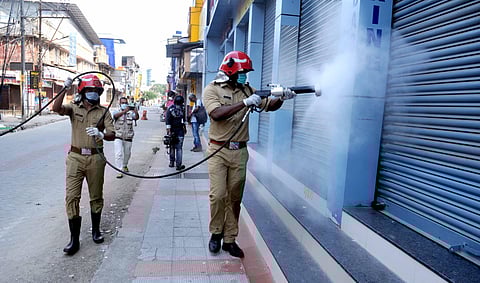 Fire and Rescue personnel disinfect a street in Kochi. (Photo | A Sanesh, EPS)