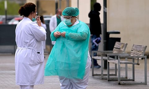 Health workers take a coffee and smoke break in Spain. (Photo| AFP)