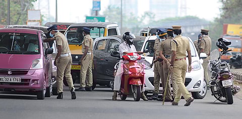 Police strictly checking the vehicles and instructing to avoid unnecessary travel, in Kochi. (Photo | A Sanesh, EPS)