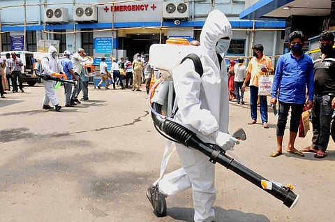 Health workers carry out disinfection in Kolkata. (Photo | PTI)