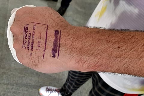 A passenger being stamped after screening. (Photo | EPS)