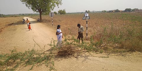 Villagers blocked the borders to control the COVID-19 by putting a warning board at Gotukuru panchayat in Anantapur district. (Photo| EPS)