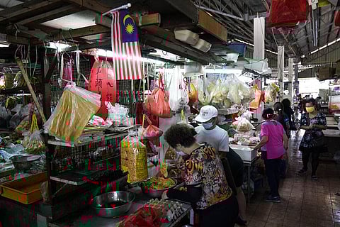 People buy food at a market during the movement control order due to the outbreak of the new coronavirus in Kajang, outskirts of Kuala Lumpur, Malaysia, Thursday, March 26, 2020. (Photo | AP)