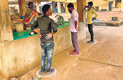 Customers maintain social distancing at Badagada Haat in Bhubaneswar | Express