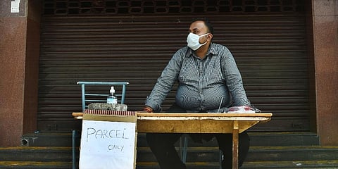 A closed Chennai hotel sells food as parcel at Mount Road on the first day of lockdown. (Photo | Ashwin Prasath, EPS)
