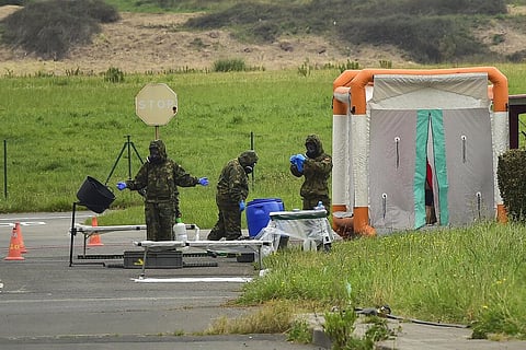 Member of Military Emergency Unit disinfect a soldier who had sprayed an area, to prevent the spread of the coronavirus, at Loiu airport, near to Bilbao, northern Spain. (Photo | AP)