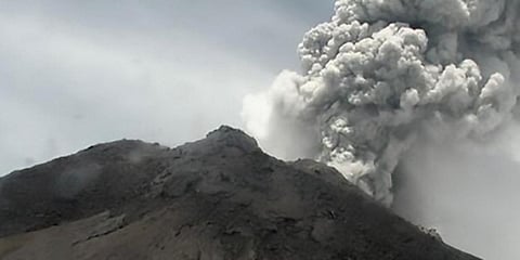 This handout picture taken and released on March 27, 2020 by Indonesia's disaster mitigation agency (BNPB) shows Mount Merapi volcano spewing thick volcanic ash as seen from Yogyakarta. (Photo | AFP/BNPB)