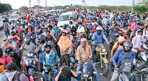 Thousands of people wait at the TS-AP border at Wadapally in Nalgonda district