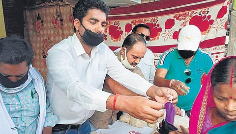 Social activist Dheeraj Roy has been providing the needy with ration | Express