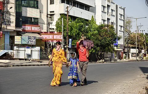 A family walks on the streets of Hyderabad due to lack of transportation amid a nation-wide lockdown.(Photo|EPS/ Vinay Madapu)
