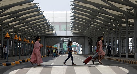 Passengers wearing mask at IGI T3 airport during the ongoing lockdown to control the spresd of coronavirus in New Delhi on Tuesday. (Photo | Shekhar Yadav/EPS)