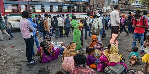 Passenger board a bus at Kaiserbagh bus stand during a nationwide lockdown in the wake of coronavirus pandemic in Lucknow. (Photo | PTI)
