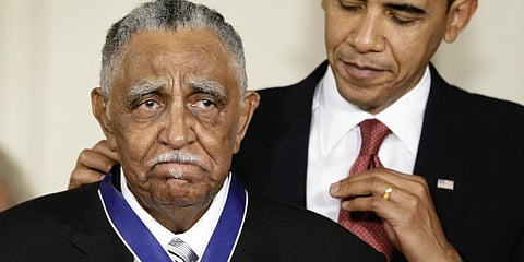 President Barack Obama presents a 2009 Presidential Medal of Freedom to the Rev. Joseph E Lowery in the East Room of the White House in Washington. (File photo | AP)