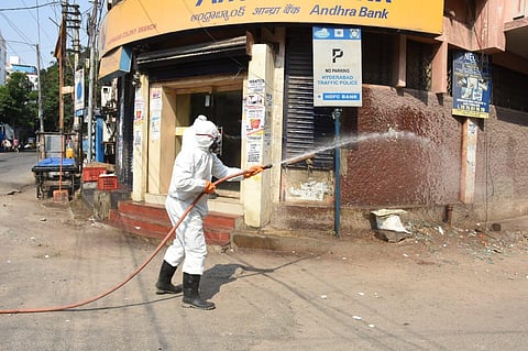 GHMC staff sanitising a street in Hyderabad on Sunday. (Photo | RVK Rao, EPS)