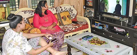 A family watches a pandemic-themed movie at their house in Mysuru | EXPRESS
