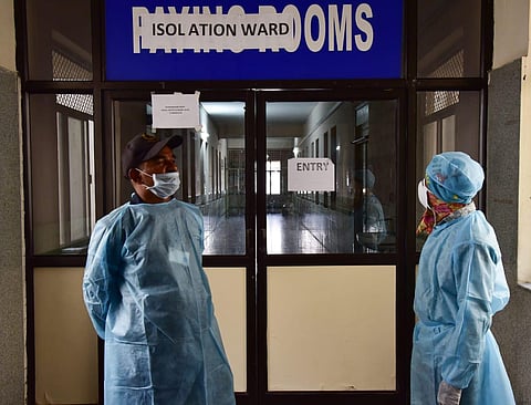 Private security personnel wearing fully protective clothes at an isolation ward for coronavirus patients at Gandhi Hospital where a man who arrived from Dubai was admitted on Monday. (Photo | Vinay Madapu/EPS)
