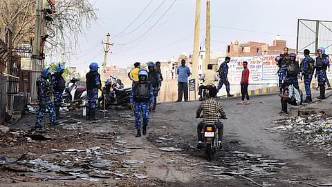 Security personnel on patrol at a northeast Delhi locality on Sunday. (Photo | Parveen Negi/EPS)