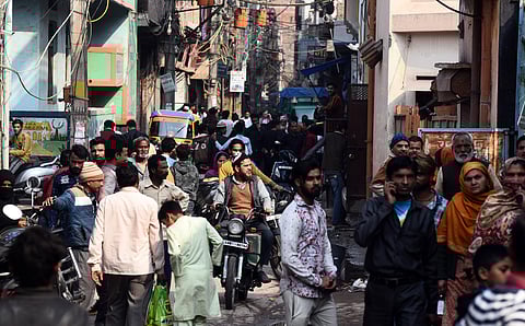 People come out on Mustafabad main road in northeast Delhi on Sunday. (Photo | Parveen Negi, EPS)