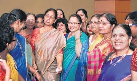 Women achievers share a light moment during the award ceremony | EXPRESS