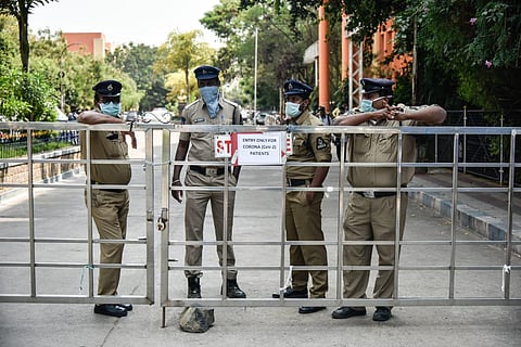 Police security at isolation ward building entry gate in Gandhi hospital, Hyderabad. (Photo | Vinay Madapu, EPS)