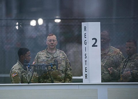 Members of the Army Corps of Engineers are seen inside the Javitz Center on March 29, 2020 in New York City. The Javits Center is expected to open as field hospital on March 30, 2020. (Photo | AFP)