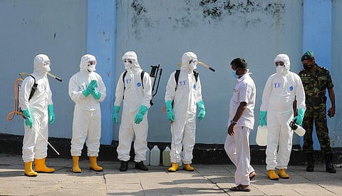 Sri Lankan police commandos prepare to spray disinfectants in a hospital in Colombo, Sri Lanka, Friday, March 27, 2020. (Photo | AP)
