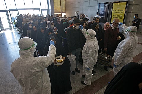 Medical staff checking passengers arriving from Iran in the airport in Najaf, Iraq, Friday, Feb. 21, 2020. (Photo | AP)