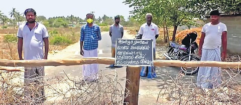 Villagers of Kullanur and S Patti have blocked roads leading to their villages with thorns and trees. (Photo | EPS)