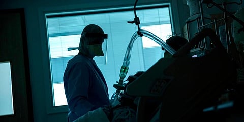 A health worker in the intensive care ward observes a COVID-19 patient at a hospital in Belgium. (Photo | AP)