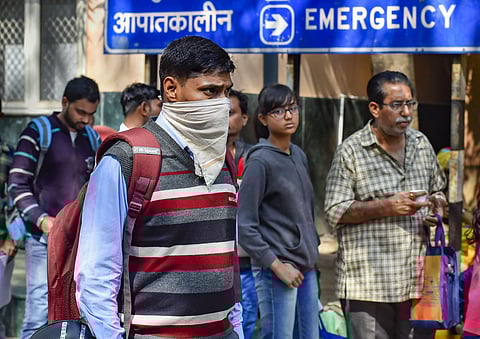 A man uses a handkerchief to cover his face in the wake of novel coronavirus or COVID-19 outbreak at RML Hospital in New Delhi Tuesday March 3 2020. (Photo | PTI)
