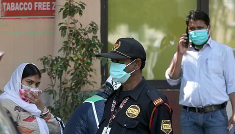 People wearing a protective mask in the wake of novel coronavirus or COVID-19 outbreak at Safderjung Hospital in New Delhi on Wednesday. (Photo | Shekhar Yadav/EPS)