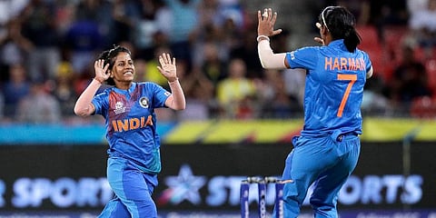 India's Poonam Yadav (L) celebrates with teammate Harmanpreet Kaurduring the first game of the Women's T20 Cricket World Cup in Sydney. (Photo | AP)