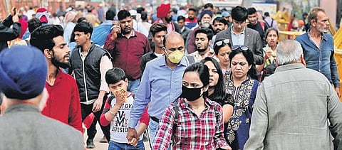 Pedestrians wear protective masks in wake of the deadly novel coronavirus at Chandni Chowk market in New Delhi on Saturday | Shekhar Yadav