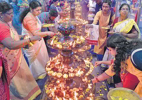 Devotees lighting the lemon lamp at Attukal Bhagavathy Temple on Saturday