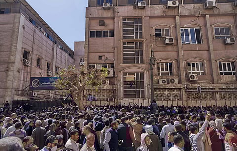 Egyptians who are traveling abroad in the next 24 hours wait for their turn to get a coronavirus test, in front of the Central Public Health Laboratories, that belongs to the Egyptian Health Ministry, in Sheikh Rihan street, downtown Cairo, Egypt, Sunday,