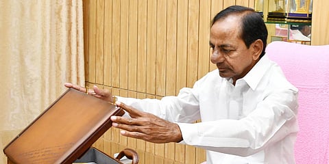 Telangana CM K Chandrasekhar Rao looking at the budget copy for the year 2020-21 in Telangana Assembly in Hyderabad. (Photo| EPS)
