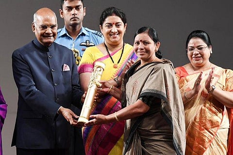 President Ram Nath Kovind presenting the NariShakti Puraskar 2019 to Ms Padala Bhudevi in Individual category for the development of tribal women, widows, Podu lands through a community-based organisation. (Photo | Twitter)