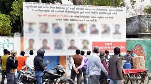 The district administration last week installed hoardings with photographs and addresses of 53 anti-CAA protesters at prominent crossings across Lucknow. (Photo | PTI)