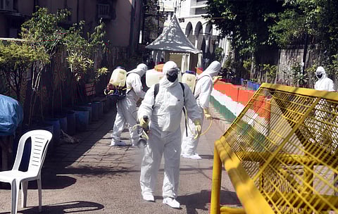 A health worker sanitises an area near Nizamuddin mosque after people who attended the religious congregation at Tabligh-e-Jamaats Markaz tested postive for COVID-19 in New Delhi on Wednesday April 1 2020. (Photo | Parveen Negi/EPS)