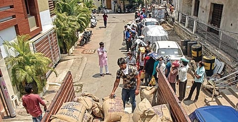 Migrants stand in queue for more than three hours at Narayanguda Melkote Park to collect rice being provided by the State government on Tuesday | Vinay Madapu