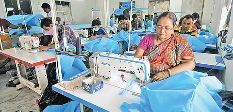 Work in progress: Tailors sew PPE kits