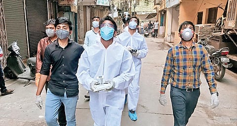 The team of Indian Robotics Solution (IRS) Pvt Ltd sanitising a colony with the Corona Combat Drone (CCD)