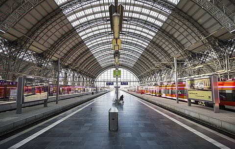 A woman sits on the platform at the main train station station in Frankfurt, Germany, Tuesday, April 7, 2020. (Photo | AP)