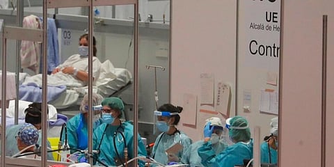 Doctors work at a temporary field hospital set in Ifema convention and exhibition in Madrid, Spain. (Photo | AP)