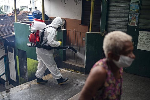 Disinfectant is sprayed on an alley to avoid the spread the new corona virus at Santa Marta slum in Rio de Janeiro, Brazil, Friday, April 10, 2020. (Photo | AP)