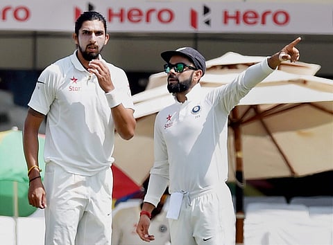 Indian skipper Virat Kohli with bowler Ishant Sharma. (File | PTI)