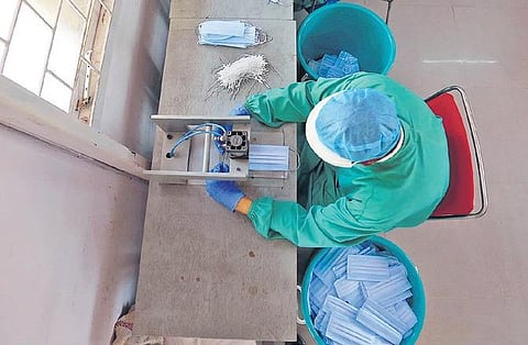 CRPF personnal stitch facemask at a CRPF Camp in RK Puram | shekhar yadav