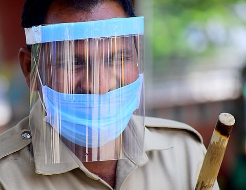 Police wear protective gear on Saturday in Bengaluru. (Photo | Pandarinath B/EPS)